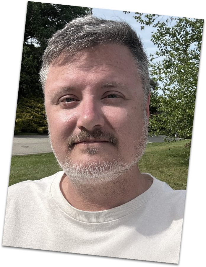 Jon Lloyd in a white t-shirt